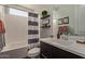 Bathroom showcasing a white vanity, decor, modern mirror, and a shower with a stylish black-and-white curtain at 6931 W Spur Dr, Peoria, AZ 85383