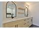 Modern bathroom features dual sinks, quartz countertop, wooden cabinets, and neutral-toned tile at 7161 E Rancho Vista Dr # 6009, Scottsdale, AZ 85254