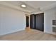 Minimalist bedroom with light-colored hardwood floors, a large window, and a closet with sliding doors at 7161 E Rancho Vista Dr # 6009, Scottsdale, AZ 85254