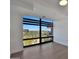 Bright living room featuring a large window offering city views and light-colored hardwood floors at 7161 E Rancho Vista Dr # 6009, Scottsdale, AZ 85251