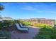 Relaxing rooftop patio featuring lounge chairs with city and mountain views at 7161 E Rancho Vista Dr # 6009, Scottsdale, AZ 85251