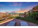 Enjoy sunset views from the rooftop deck with lounge chairs and green landscaping at 7161 E Rancho Vista Dr # 6009, Scottsdale, AZ 85251