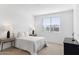 This bright bedroom is complemented by neutral-toned walls, and bedside lamps for warm lighting at 7378 W Whitehorn Trl, Peoria, AZ 85383