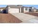 Charming home featuring a two-car garage, concrete driveway, and stone accents at 7378 W Whitehorn Trl, Peoria, AZ 85383