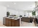 Open-concept kitchen with a center island that transitions seamlessly into the living area at 7378 W Whitehorn Trl, Peoria, AZ 85383