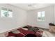 Bright bedroom with carpet, a ceiling fan, and windows offering outdoor views at 7515 N 185Th Ave, Waddell, AZ 85355