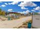 Equestrian property address with horse enclosures, sunshades, and mature trees at 7515 N 185Th Ave, Waddell, AZ 85355