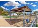 Outdoor horse pen area with sunshade and lush green area for the horses at 7515 N 185Th Ave, Waddell, AZ 85355