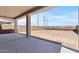 Covered back patio area offering a spacious area overlooking the backyard perfect for outdoor activities at 7988 W Griswold Rd, Peoria, AZ 85345