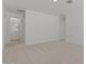 Spacious bedroom with adjoining bathroom and plush carpeting throughout the room at 7988 W Griswold Rd, Peoria, AZ 85345