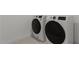 Modern laundry room featuring front-load washer and dryer units for convenient laundry care at 7988 W Griswold Rd, Peoria, AZ 85345