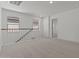 Open loft area with carpet, white railing, and natural light from the windows at 7988 W Griswold Rd, Peoria, AZ 85345