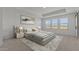 Spacious bedroom featuring tray ceiling, carpet, neutral walls, large windows, and modern stylish decor at 7988 W Griswold Rd, Peoria, AZ 85345