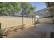 Spacious backyard featuring a covered patio and privacy wall at 838 W Duke Dr, Tempe, AZ 85283