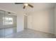 Bright bedroom with ceiling fan, closet with mirrored doors, and natural light at 838 W Duke Dr, Tempe, AZ 85283