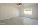 This bedroom offers neutral walls, modern ceiling fan, and plenty of natural light at 838 W Duke Dr, Tempe, AZ 85283