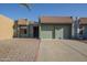 Charming single-story home featuring a two-car garage, desert landscaping, and a classic tile roof at 838 W Duke Dr, Tempe, AZ 85283