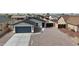 Charming single-story home featuring a two-car garage and low maintenance desert landscaping at 8852 W Swansea Dr, Arizona City, AZ 85123