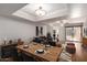 Open-concept dining area flowing into the living room with modern table setting and comfortable seating at 9355 N 91St St # 113, Scottsdale, AZ 85258