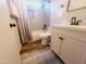 Cozy bathroom with white subway tile shower and modern vanity with matte black hardware at 9654 N 94Th Ave, Peoria, AZ 85345