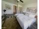 Bright bedroom featuring neutral decor, a ceiling fan, and artistic accents create a serene retreat at 9654 N 94Th Ave, Peoria, AZ 85345