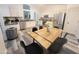 Bright kitchen with a view of the dining area featuring stainless steel appliances and granite countertops at 9654 N 94Th Ave, Peoria, AZ 85345