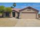 Charming single-story home featuring a tile roof, desert landscaping, and a two-car garage at 9654 N 94Th Ave, Peoria, AZ 85345