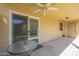 Back patio with table and chairs, and access to the house through a sliding glass door at 1021 S Greenfield Rd # 1213, Mesa, AZ 85206