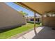 Backyard with gravel, green grass, and a covered back patio at 1021 S Greenfield Rd # 1213, Mesa, AZ 85206