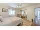 Well-lit bedroom with a mirror closet, plush bedding, and soft natural light streaming through the window at 1021 S Greenfield Rd # 1213, Mesa, AZ 85206