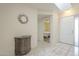 Entryway with tile flooring, half-moon entry table and mirror, with views to adjacent rooms at 1021 S Greenfield Rd # 1213, Mesa, AZ 85206