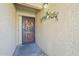 Inviting front entrance with a decorative security screen door and decorative wall art at 1021 S Greenfield Rd # 1213, Mesa, AZ 85206