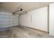 Garage space with painted walls and concrete flooring, equipped with an automatic door at 1021 S Greenfield Rd # 1213, Mesa, AZ 85206