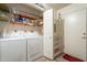 Laundry room with washer, dryer, shelving and utility sink at 1021 S Greenfield Rd # 1213, Mesa, AZ 85206