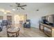 Spacious living room with modern flooring, ceiling fan, and an open layout perfect for entertaining guests at 1021 S Greenfield Rd # 1213, Mesa, AZ 85206