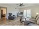 Comfortable living room with a recliner, sofa, and sliding doors leading to the outdoor patio at 1021 S Greenfield Rd # 1213, Mesa, AZ 85206
