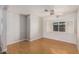 Cozy bedroom featuring laminate floors, a ceiling fan, and ample natural light at 106 S 74Th St, Mesa, AZ 85208