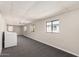 Bonus room with neutral paint and carpeting, multiple windows and a laundry area at 106 S 74Th St, Mesa, AZ 85208