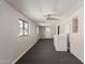 Bonus room with modern ceiling fan, vinyl windows, and laundry hookups at 106 S 74Th St, Mesa, AZ 85208
