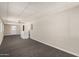 Large bonus room with bright walls, dark carpet, and access to the exterior at 106 S 74Th St, Mesa, AZ 85208