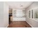Bright dining area featuring wood floors, built-in cabinets, and natural light at 106 S 74Th St, Mesa, AZ 85208