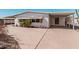 Charming home with a covered carport, desert landscaping, and inviting curb appeal at 106 S 74Th St, Mesa, AZ 85208