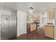 Bright kitchen features stainless steel appliances, light wood cabinets, and vinyl wood flooring at 106 S 74Th St, Mesa, AZ 85208