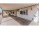 Exterior view of the covered patio area with shade awning, privacy screen, and access to the home at 106 S 74Th St, Mesa, AZ 85208