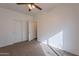 Standard bedroom features neutral walls, carpet floors, and a double-door closet at 1100 E Canyon Trl, San Tan Valley, AZ 85143