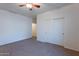 Carpeted bedroom with a ceiling fan and a closet at 1100 E Canyon Trl, San Tan Valley, AZ 85143