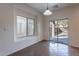 Sunny dining area with tile floors and sliding glass door to the backyard at 1100 E Canyon Trl, San Tan Valley, AZ 85143