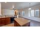 Traditional eat-in kitchen with an island and adjacent living space at 1100 E Canyon Trl, San Tan Valley, AZ 85143