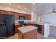 Traditional eat-in kitchen with tile flooring and black appliances at 1100 E Canyon Trl, San Tan Valley, AZ 85143