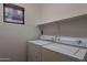 Laundry room features a window and washer and dryer hookups at 1100 E Canyon Trl, San Tan Valley, AZ 85143